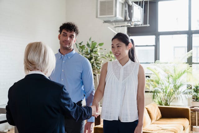 a property manager speaking with two tenants