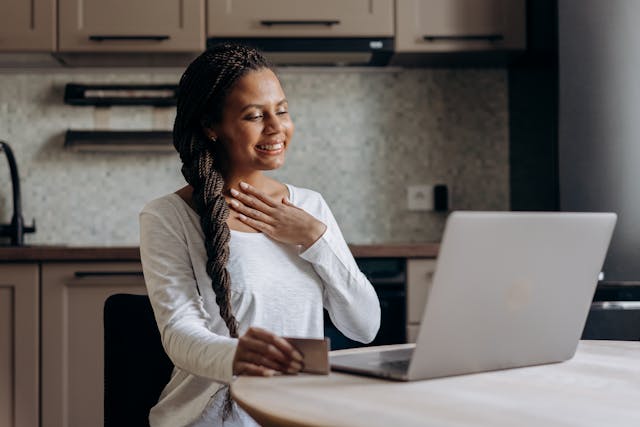 Person making an online rent payment with a credit card