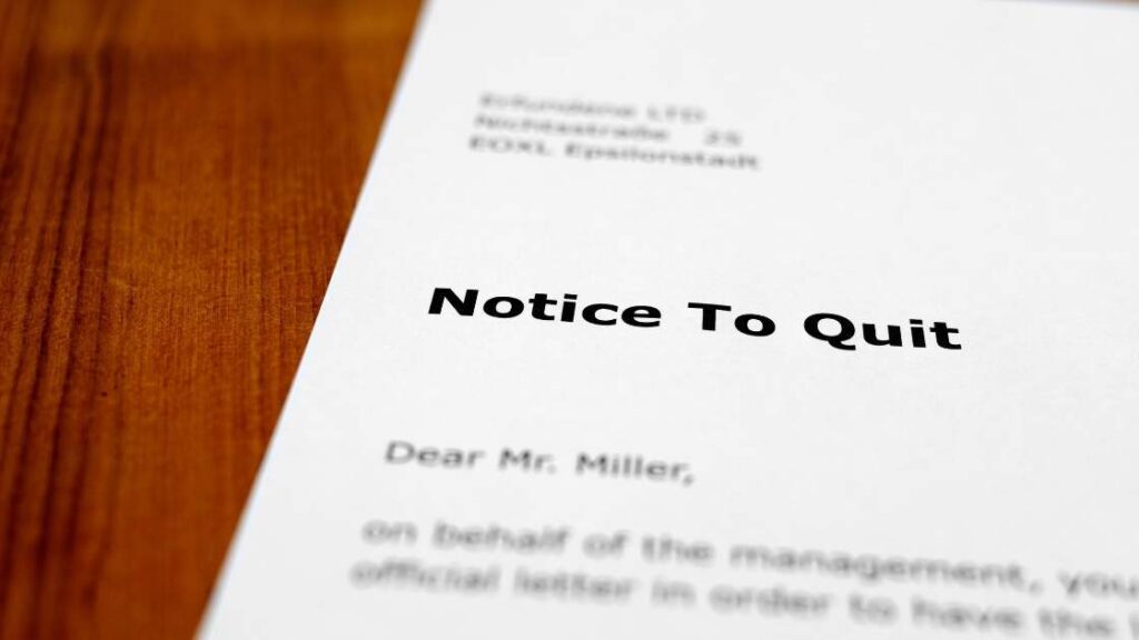 a notice to quit document on a desk