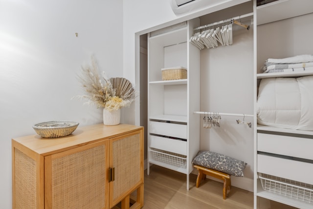 a large closet with a built-in storage unit